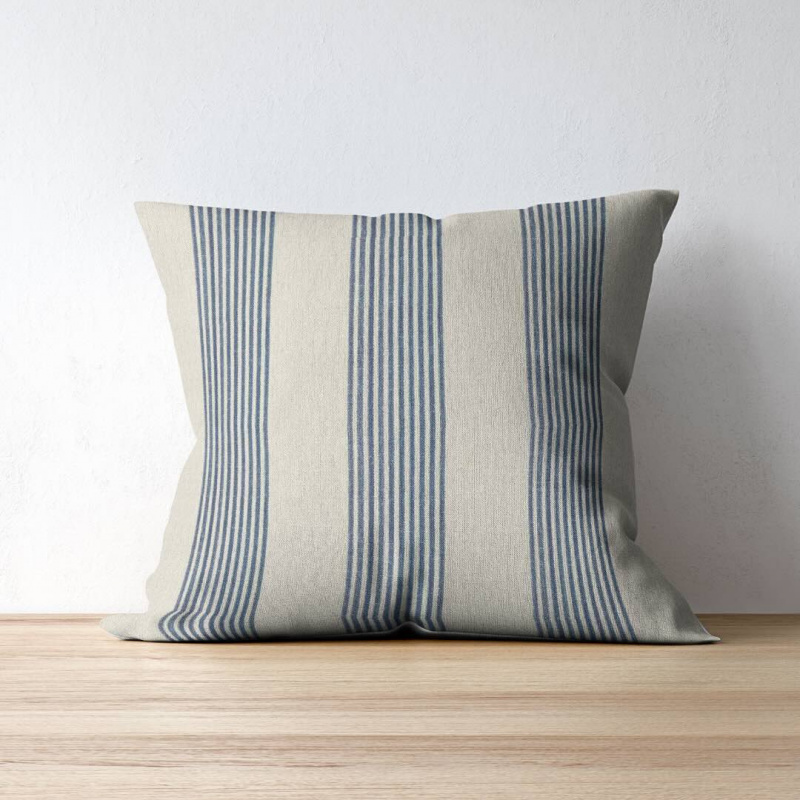 Correfoc Indigo Blue fabric by Teixits Riera on a throw pillow